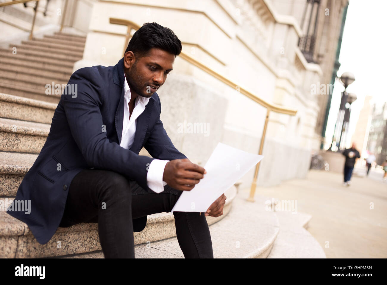 Indian man reading hi-res stock photography and images - Alamy