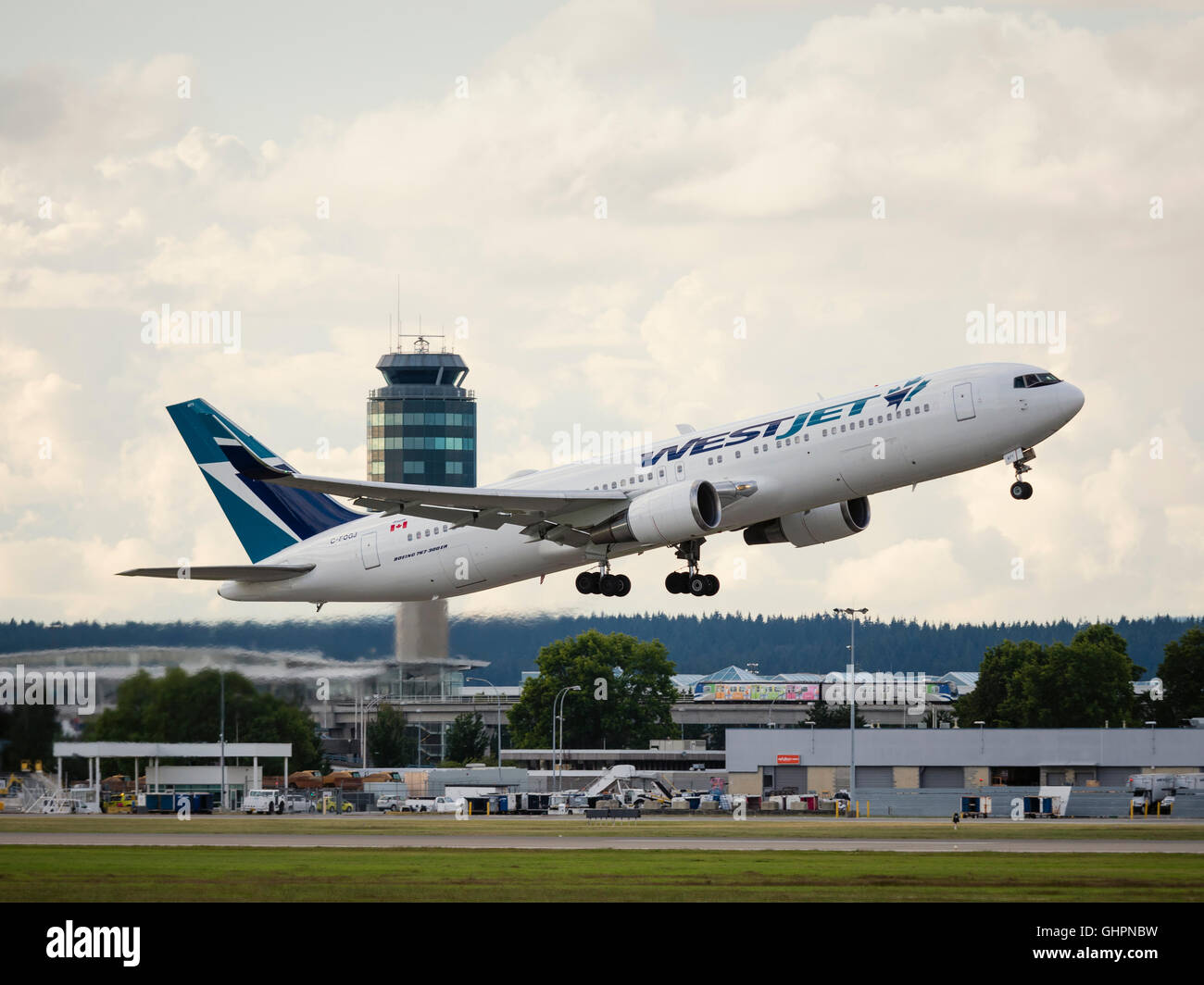 WestJet Airlines Boeing 767-300ER C-FOGJ take taking off airborne departing Vancouver International Airport Canada Stock Photo