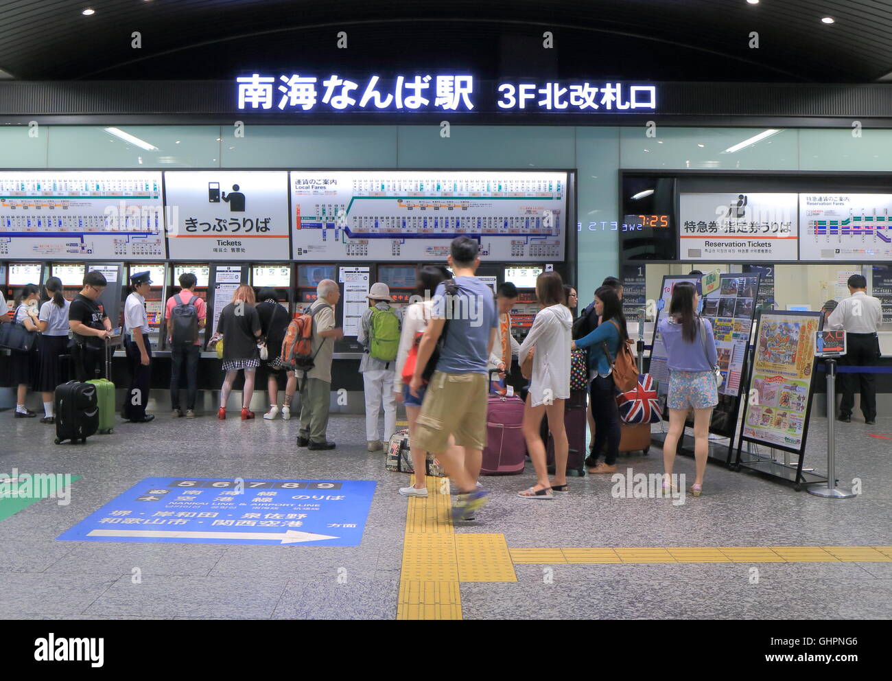 People queue to buy tickets at Nankai Nanba Station in Osaka Japan. Stock Photo