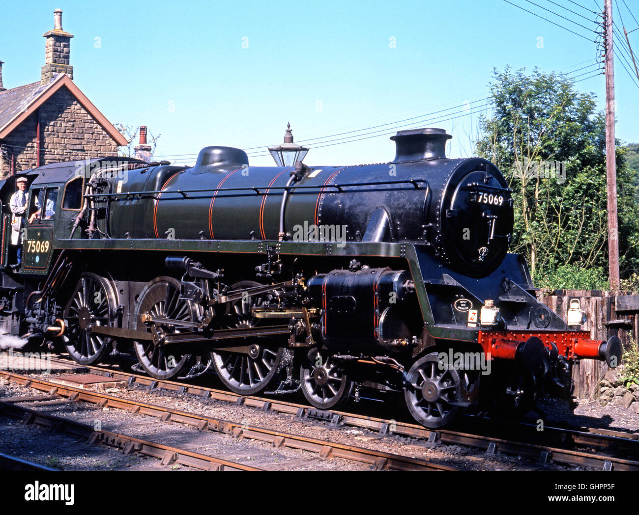 British Railways Standard Class 4 4-6-0 steam locomotive number 75069 pulling out of Severn Valley railway Station, Highley, UK. Stock Photo