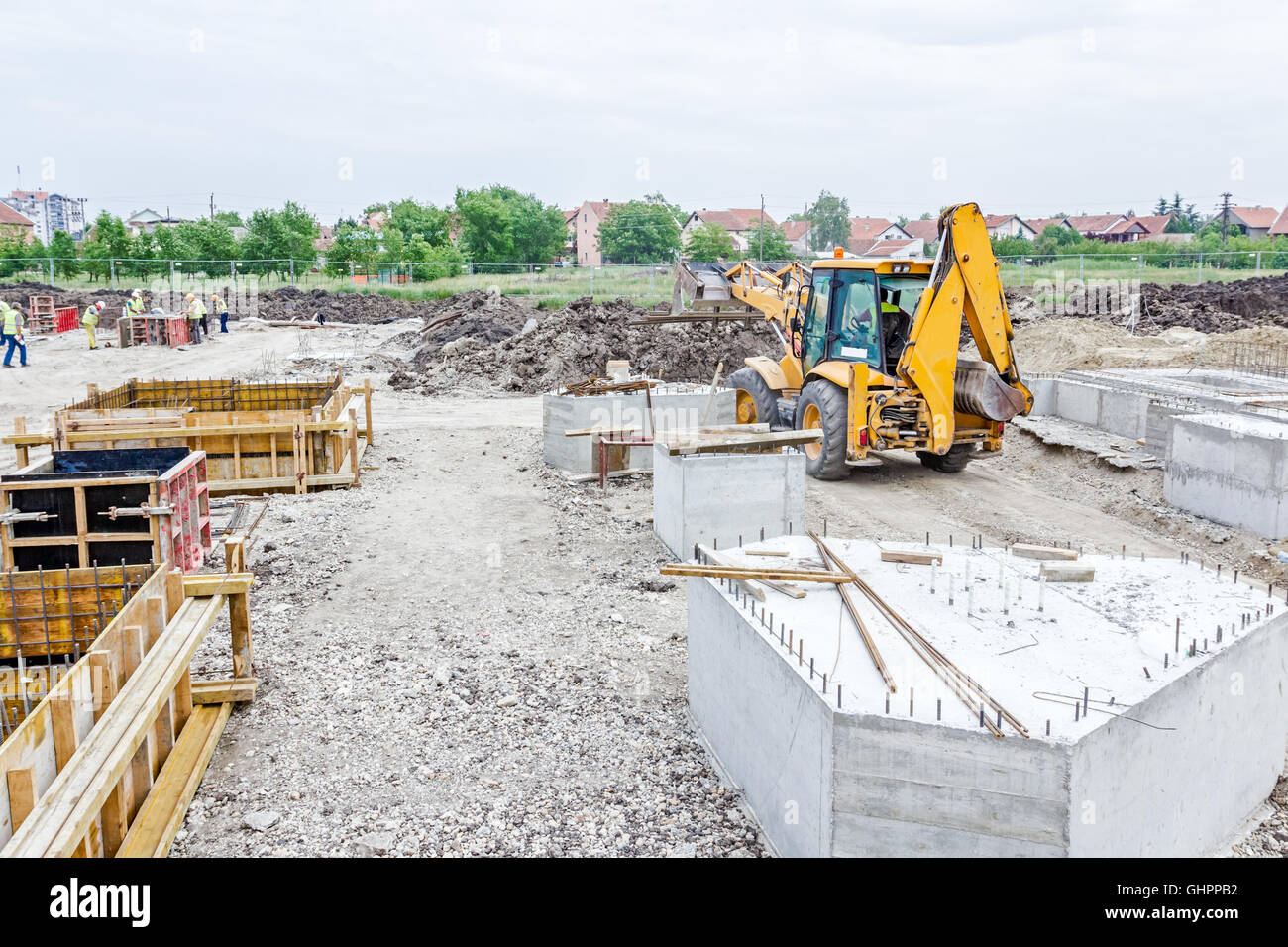 Excavator with inserted forklift is loaded with forklift is metal bars