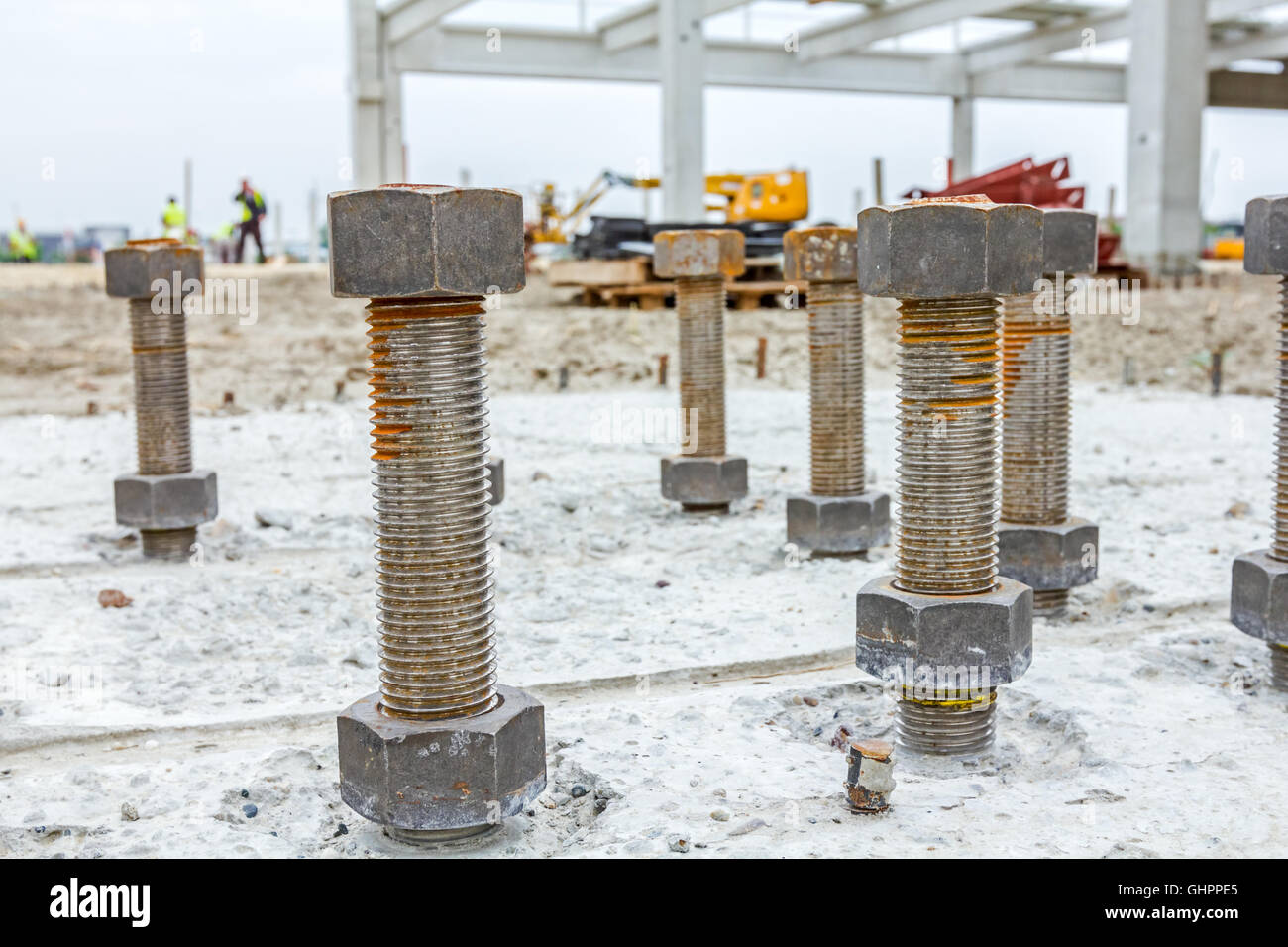 Close up the anchor bolts in concrete base of new edifice with
