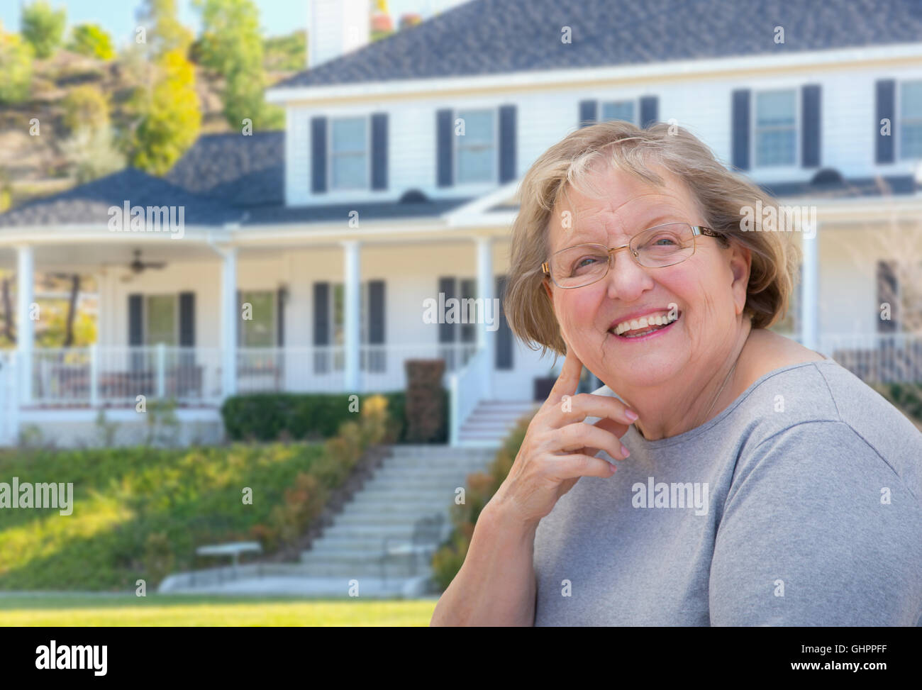 Elderly woman in front house hi-res stock photography and images - Alamy