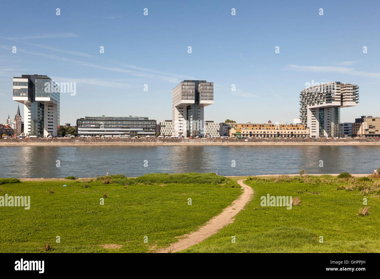 Crane Houses (german Kranhaus) at the Rhine River in Cologne as seen from opposite river bank Stock Photo