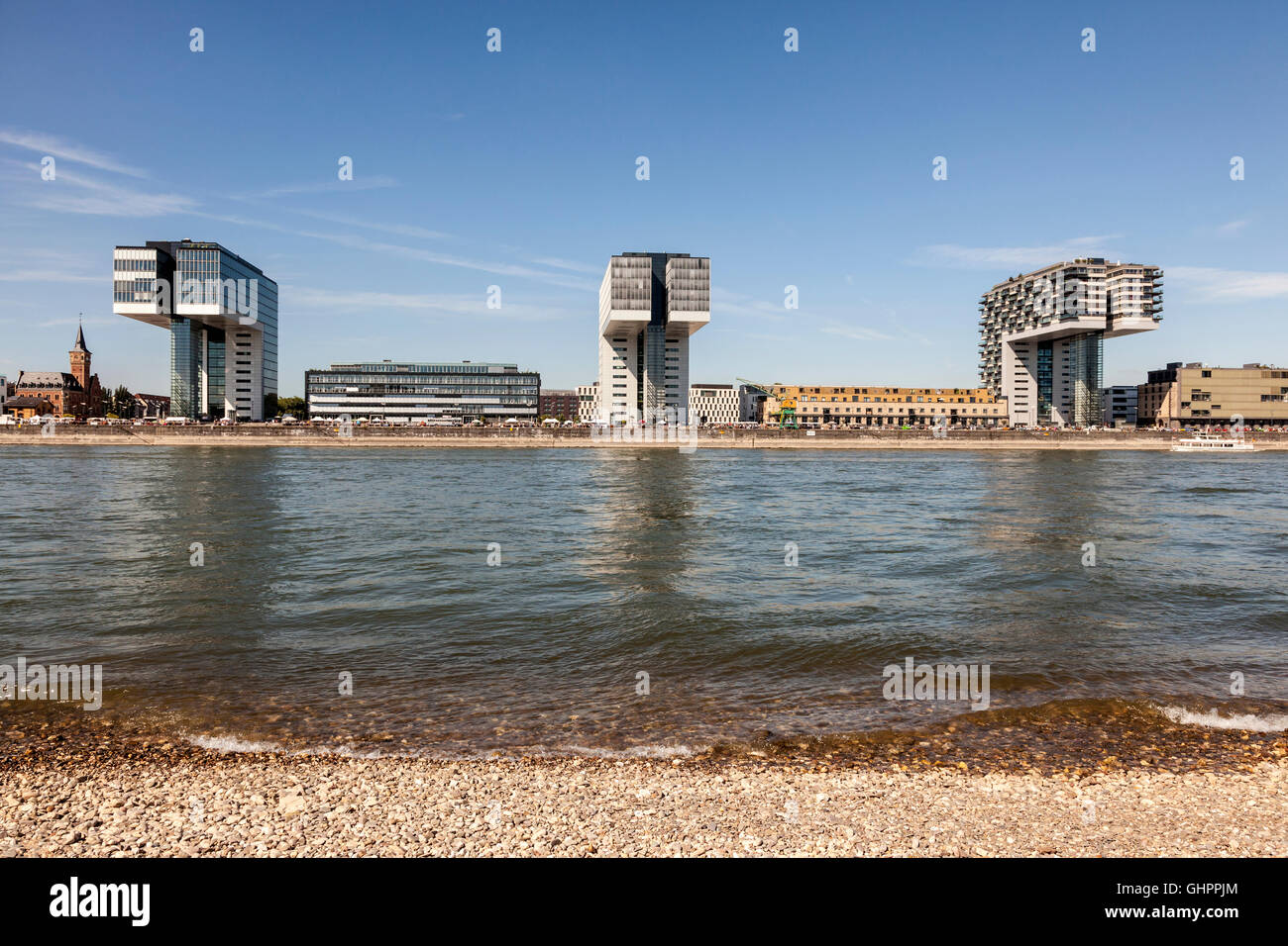 Crane Houses (german Kranhaus) at the Rhine River in Cologne as seen from opposite river bank Stock Photo