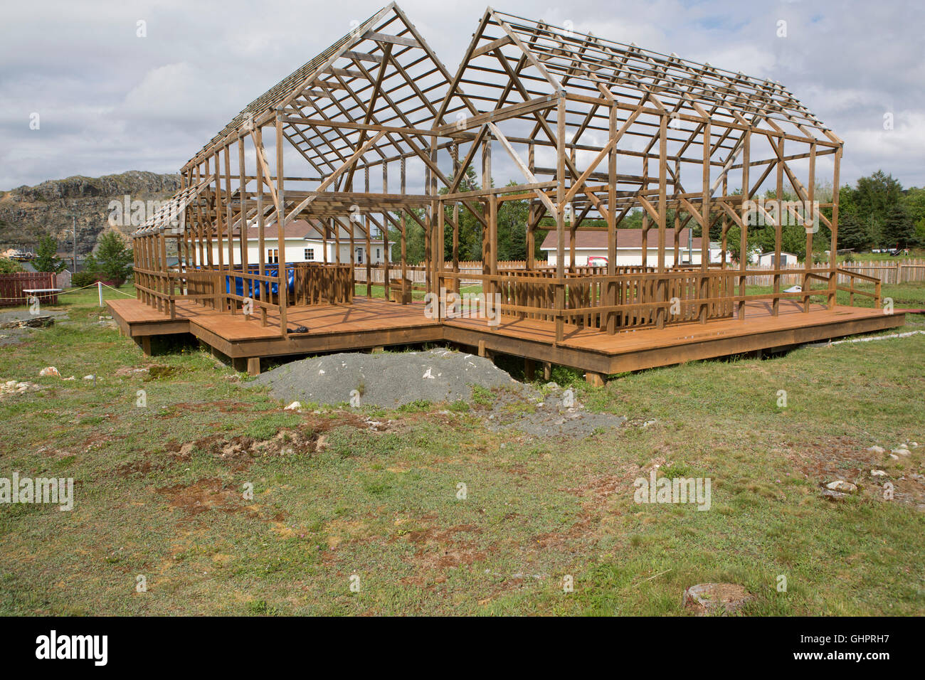 Timber frames outline the buildings that once stood on the Plantation Site at Cupids in Newfoundland and Labrador, Canada. The s Stock Photo