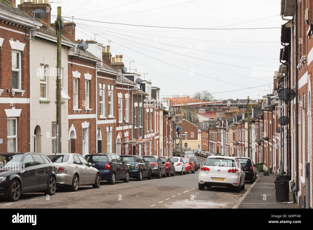 Residential terraced housing including student flats and houses leading down to St James Park football ground, Exeter, Devon, uk Stock Photo