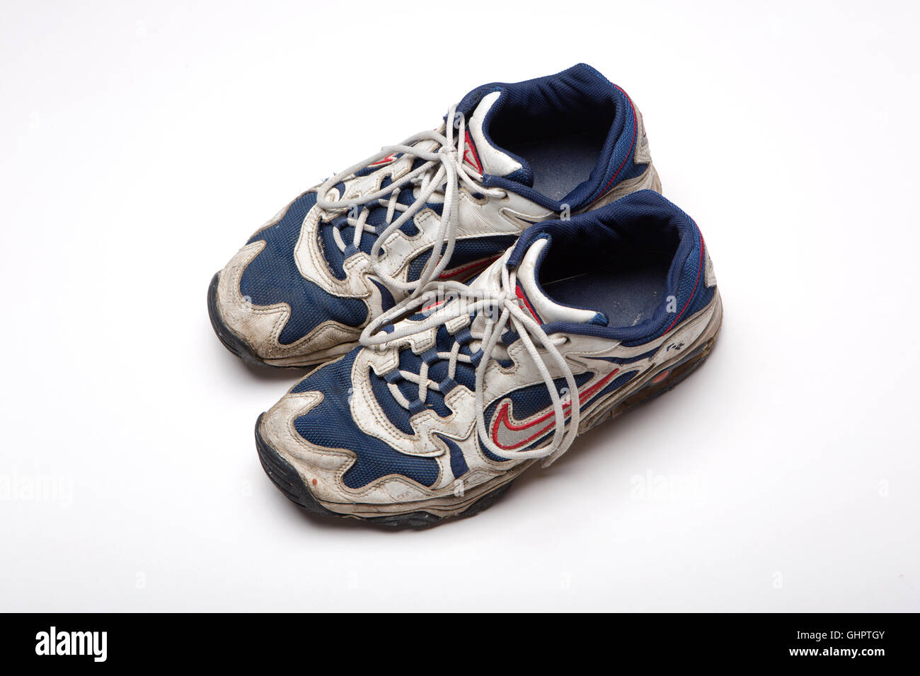 Old, well worn trainers Stock Photo - Alamy