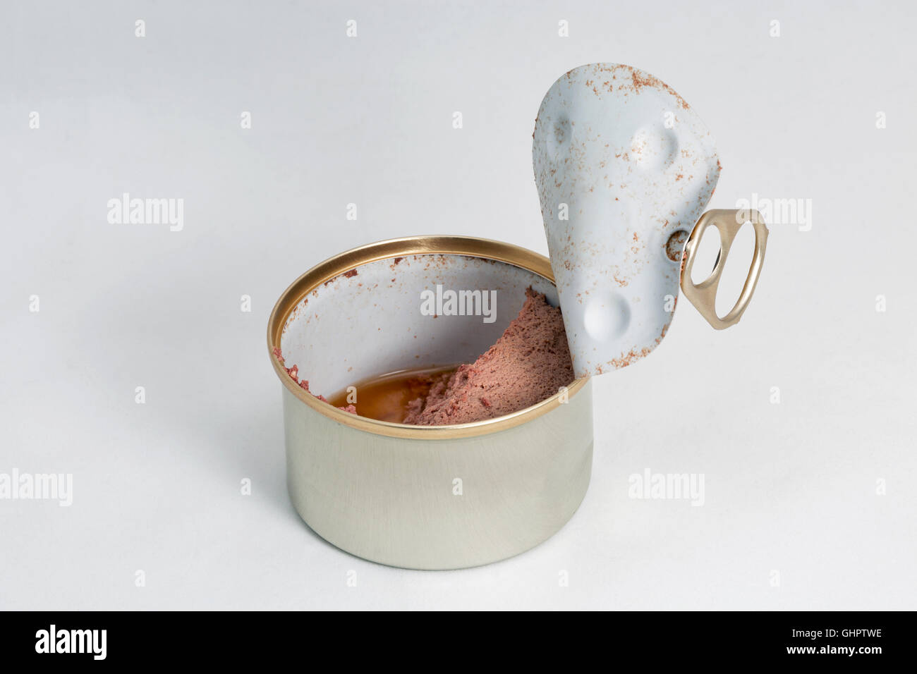 Open pet food can on white background closeup with copy space Stock