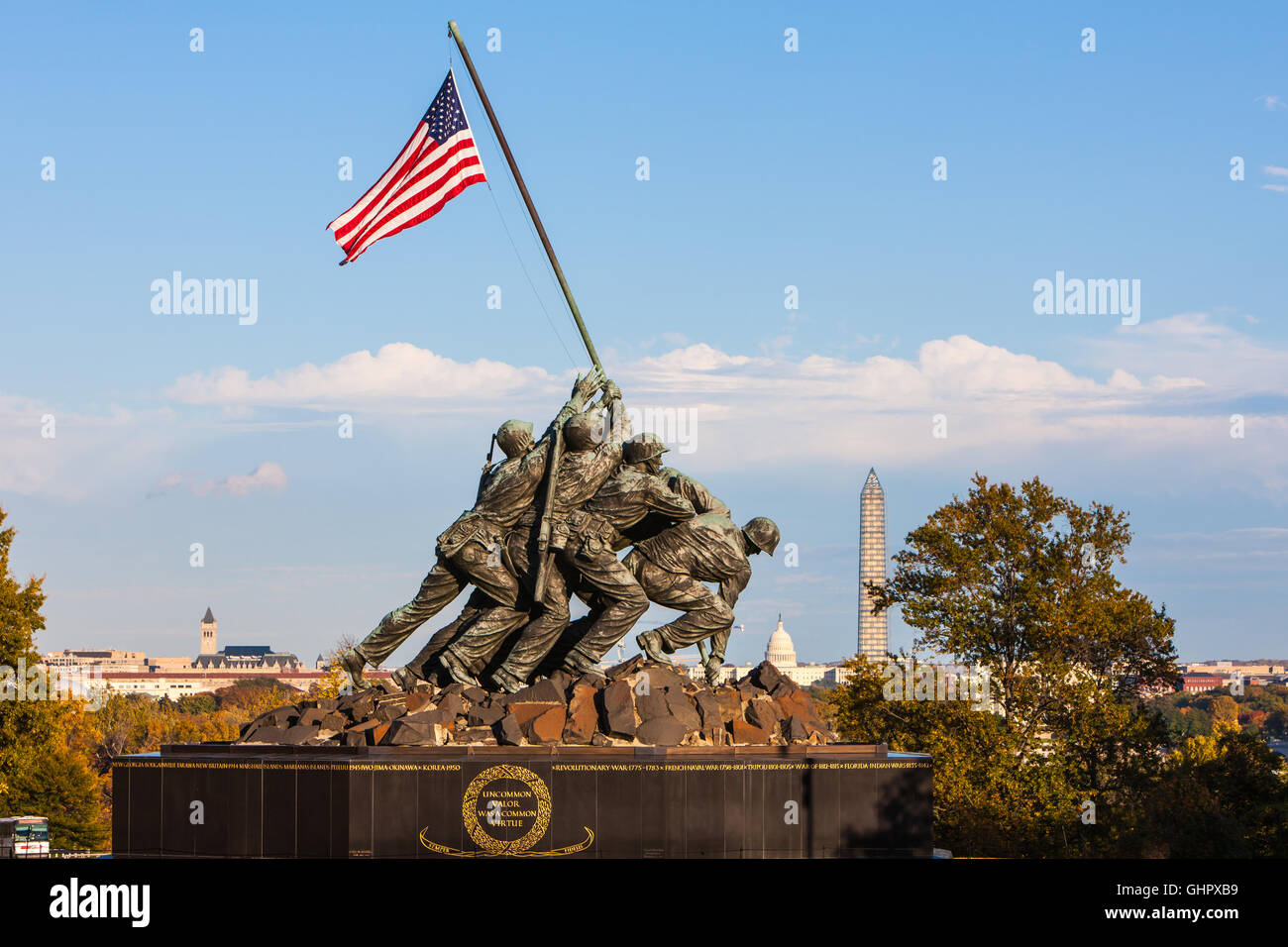 The US Marine Corps War Memorial with Washington landmarks in the background in Arlington, Virginia. Stock Photo