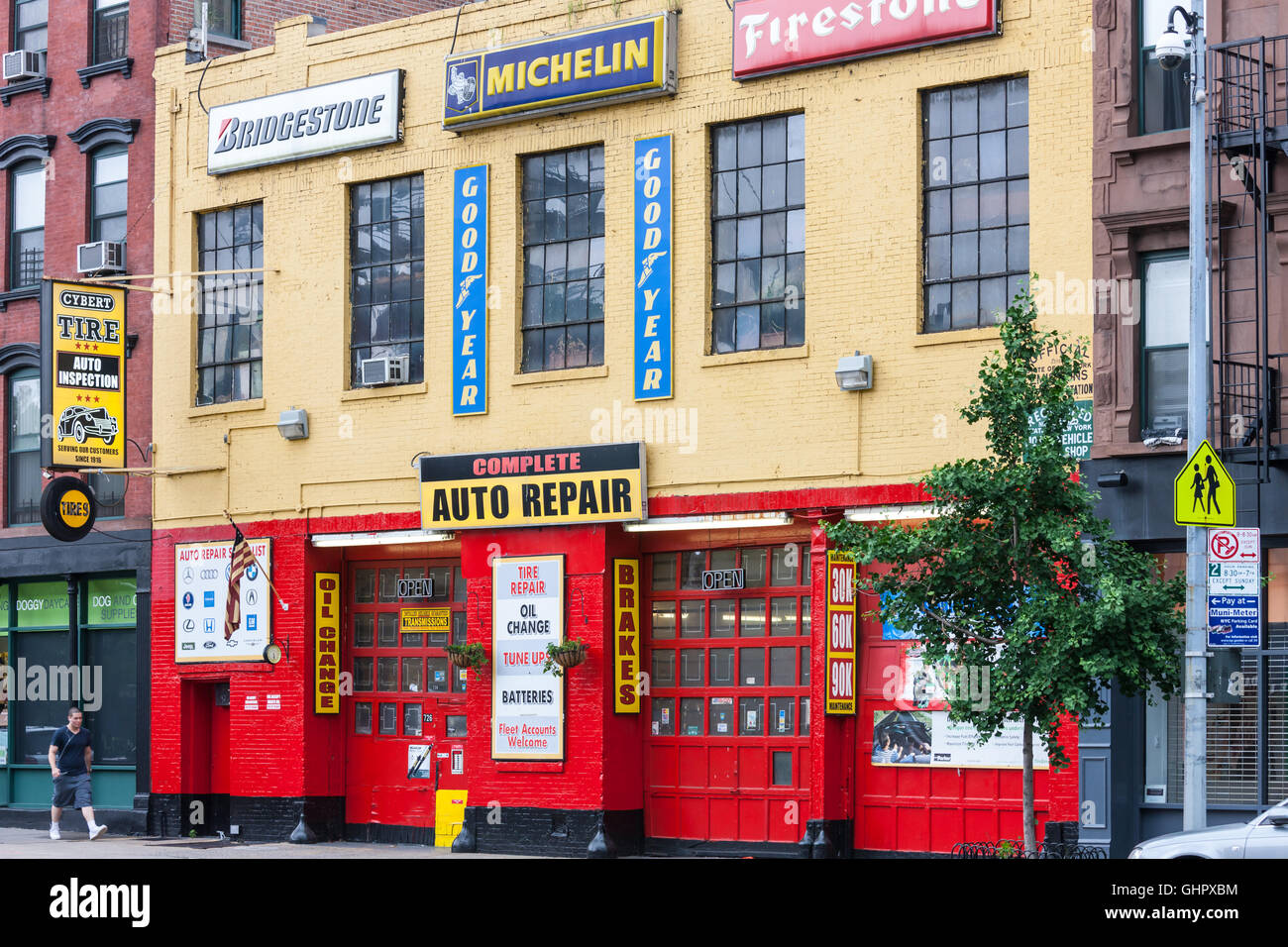 The colorful facade of Cybert Tire, an auto repair shop and tire center in New York City. Stock Photo