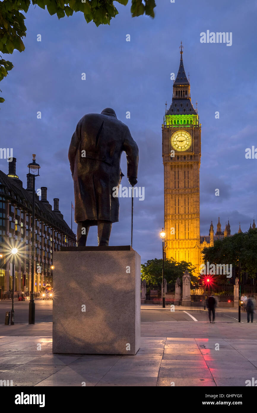 The statue of Winston Churchill and Big Ben at night, Westminster, London Stock Photo