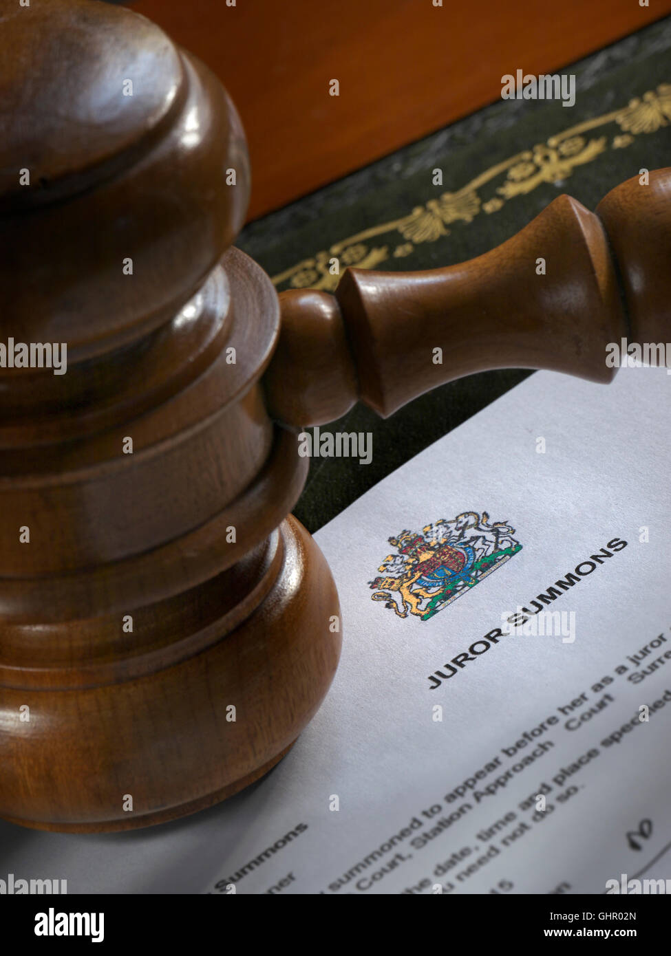 JUROR JURY SUMMONS Law Court Legal concept with Judges Gavel on Juror Summons letter Stock Photo