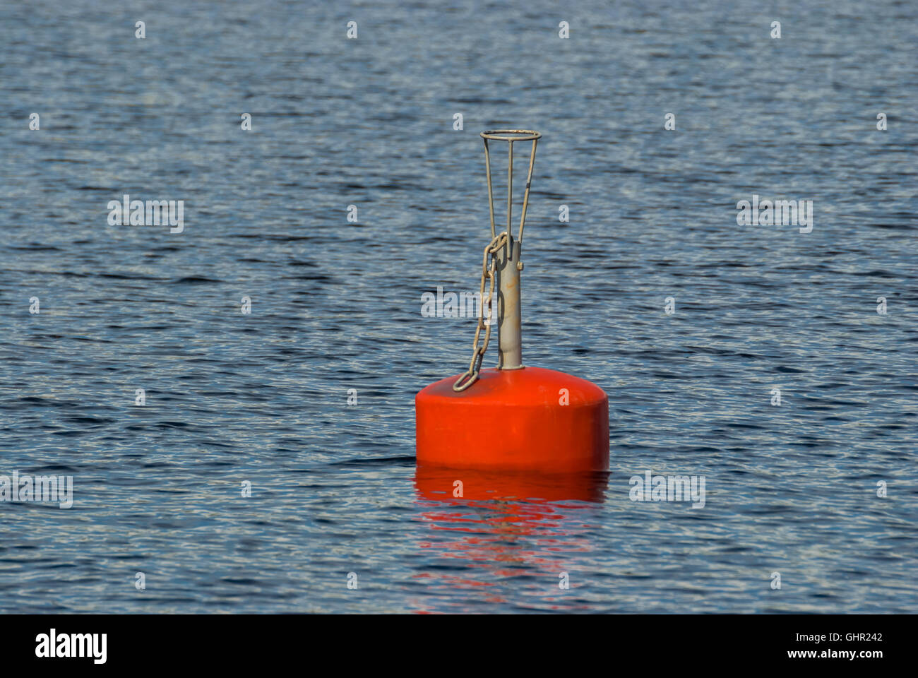Flashing red buoy on the water surface of lake Saimaa in the Finnish city of Imatra Stock Photo