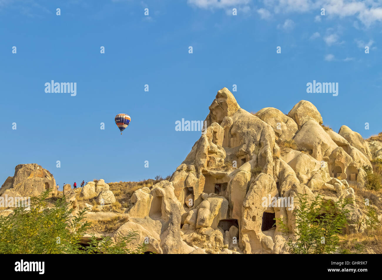 Turkey Cappadocia Balloon Over Rock Houses Stock Photo