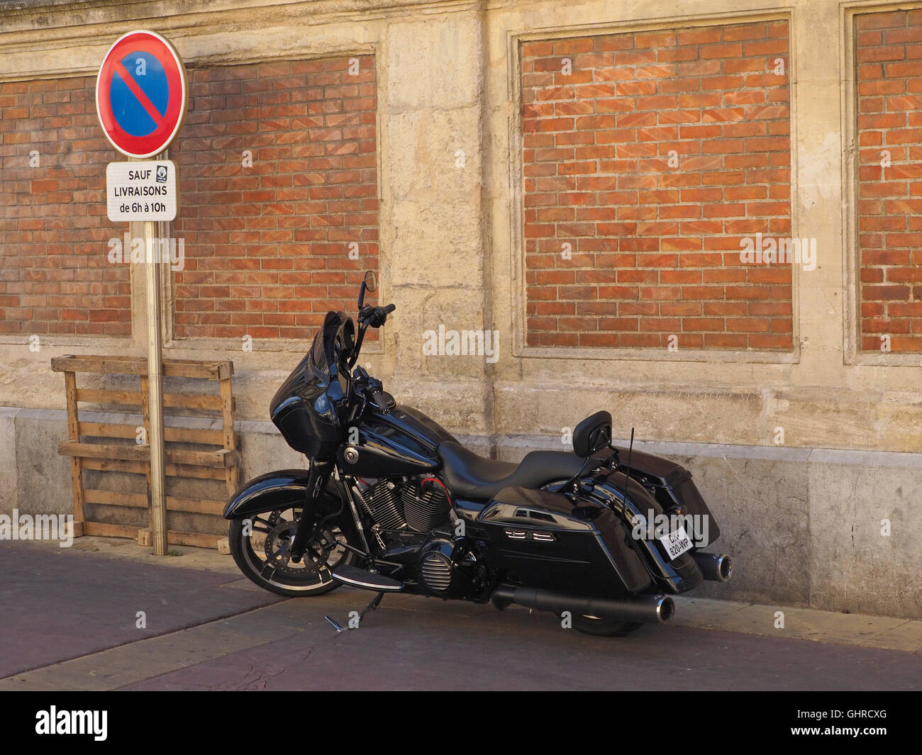 All black custom Harley Davidson motorcycle in bagger style, photographed in Narbonne, France Stock Photo