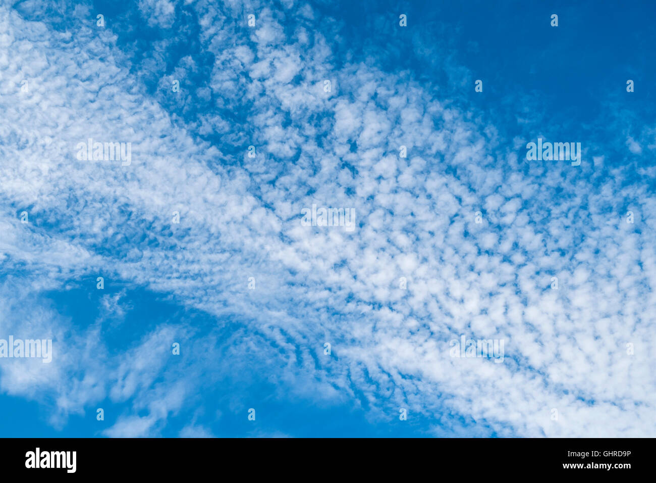 Blue sky with mottled cirrocumulus high clouds - France. Stock Photo