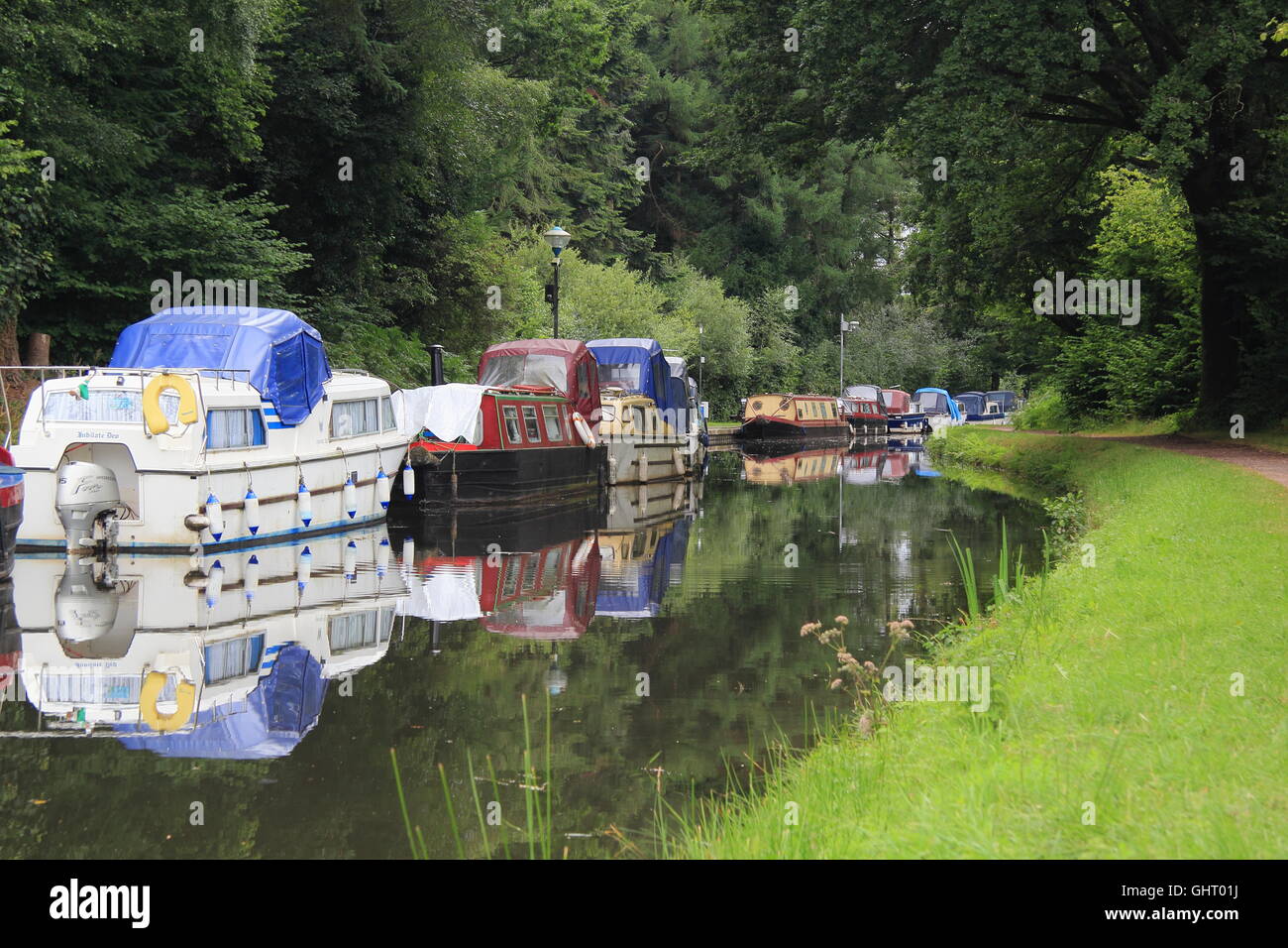 Narrowboats moored on the Monmouthshire and Brecon Canal at Goytre Wharf near Abergavenny, South Wales, Cymru, UK -  July Stock Photo