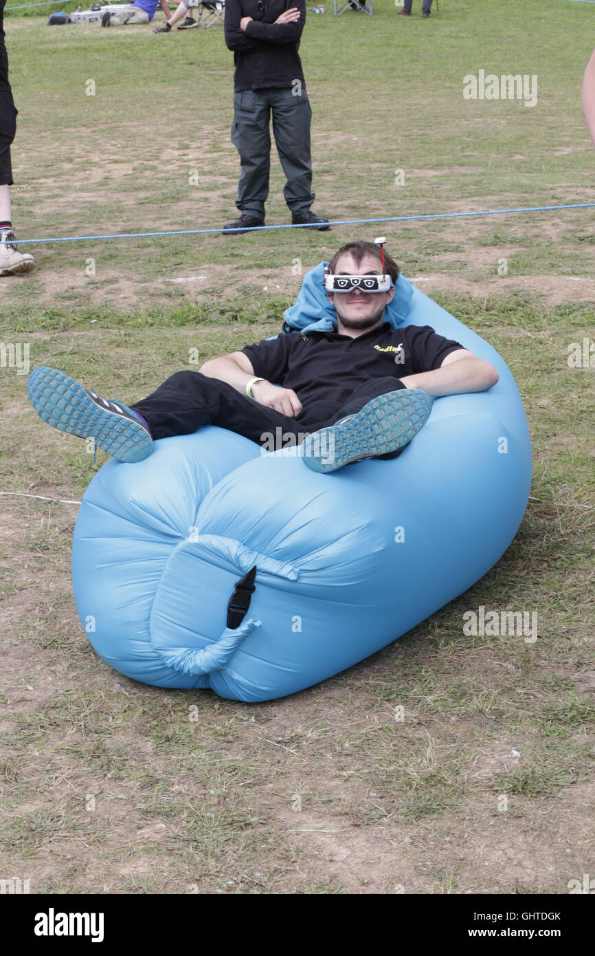 SUNDAY 31st July 2016.  FPV drone racer pilot, MAtthew Hellier relaxes at the flightline prior to racing at the UK drone racing  Stock Photo