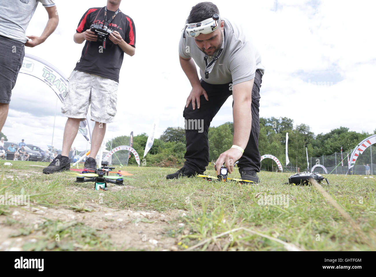 Drone Racing Queen's Cup 2016.  Richard Whelan, aka, ThatHPI Guy and other pilots place their drone at the start line. Stock Photo