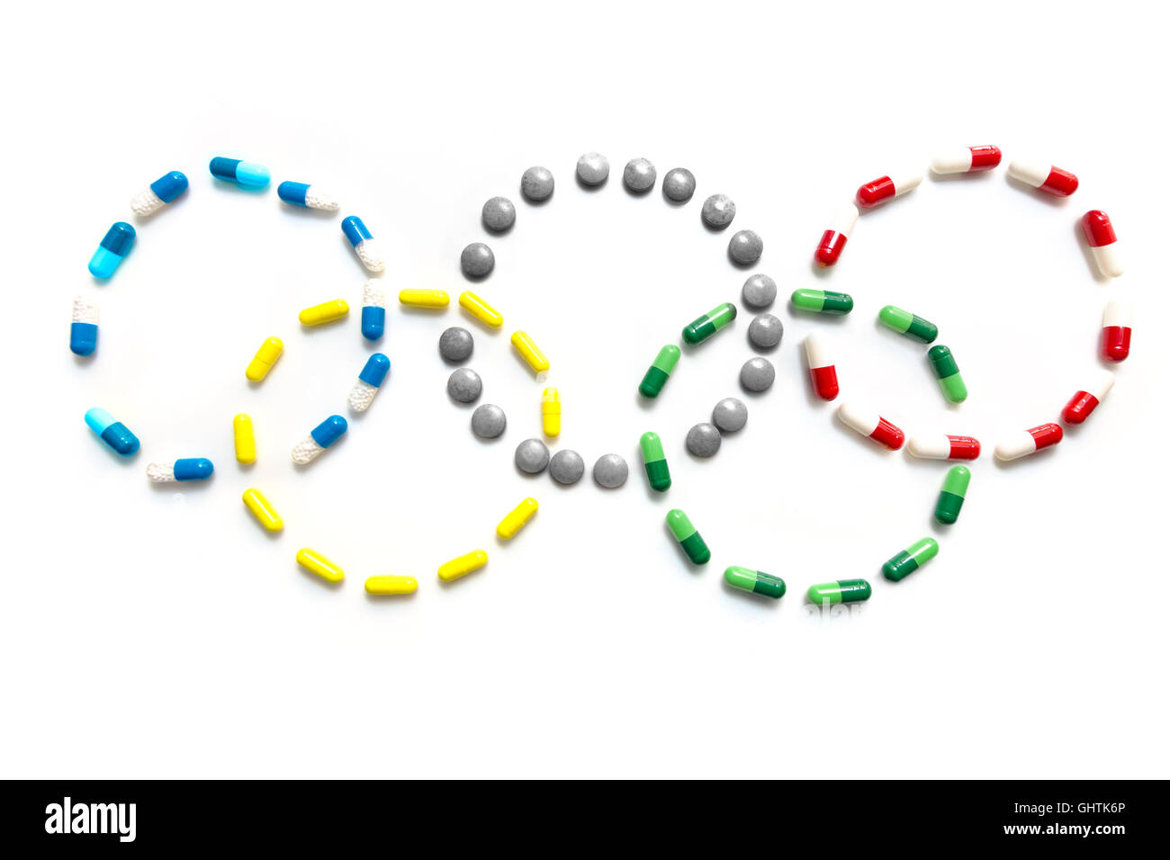 A range of pills and tablet drugs/medicines arranged in the Olympic Rings Logo Stock Photo