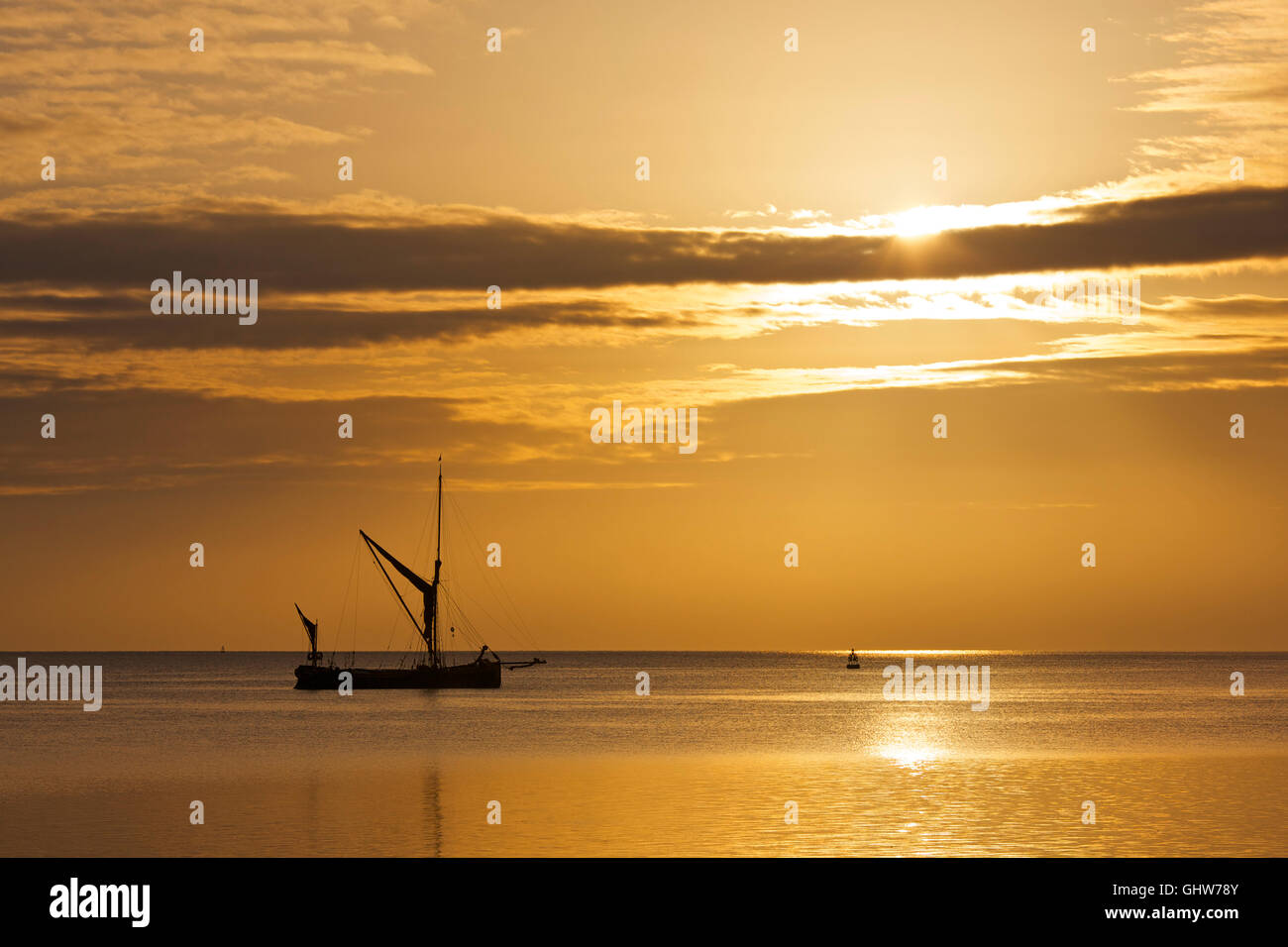 Swale estuary, Kent, UK. 12th August 2016: UK Weather. Sunrise at the Swale estuary as Thames sailing barges start to gather for the 44th Swale smack and sailing barge match which is to be held on Saturday. Dry and warm weather is forecast for the coming week Credit:  Alan Payton/Alamy Live News Stock Photo