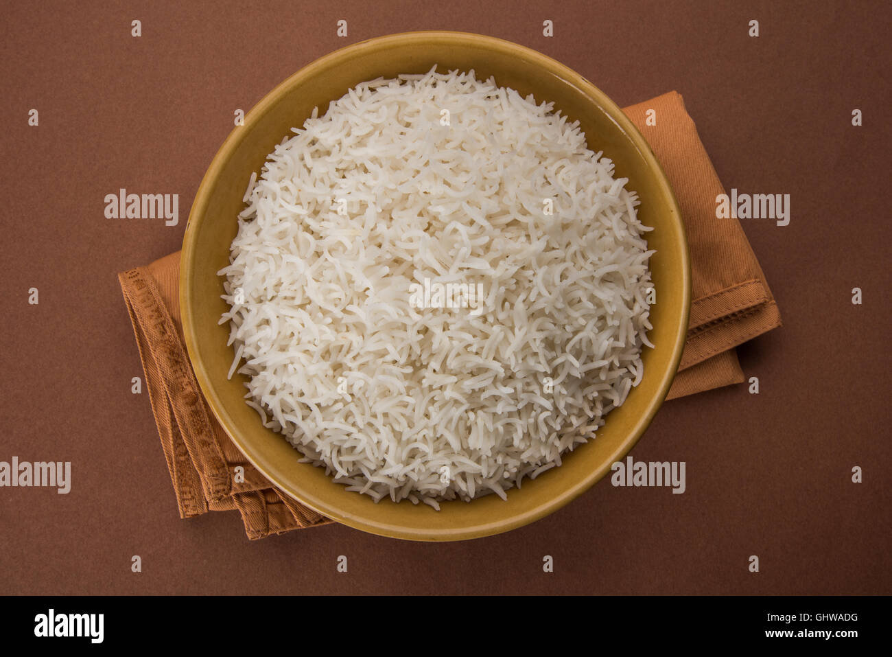 basmati rice in a brass bowl, cooked basmati rice, cooked plain rice