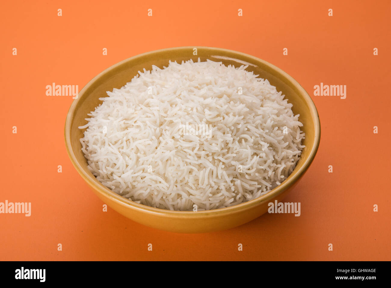 basmati rice in a brass bowl, cooked basmati rice, cooked plain rice