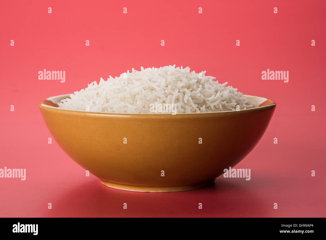 basmati rice in a brass bowl, cooked basmati rice, cooked plain rice