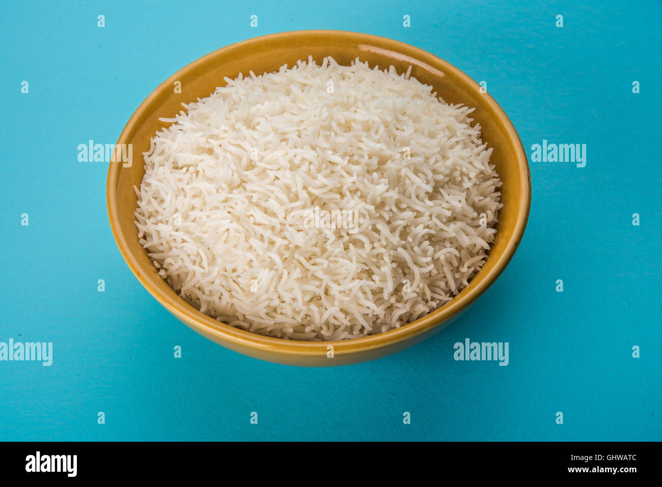 basmati rice in a brass bowl, cooked basmati rice, cooked plain rice