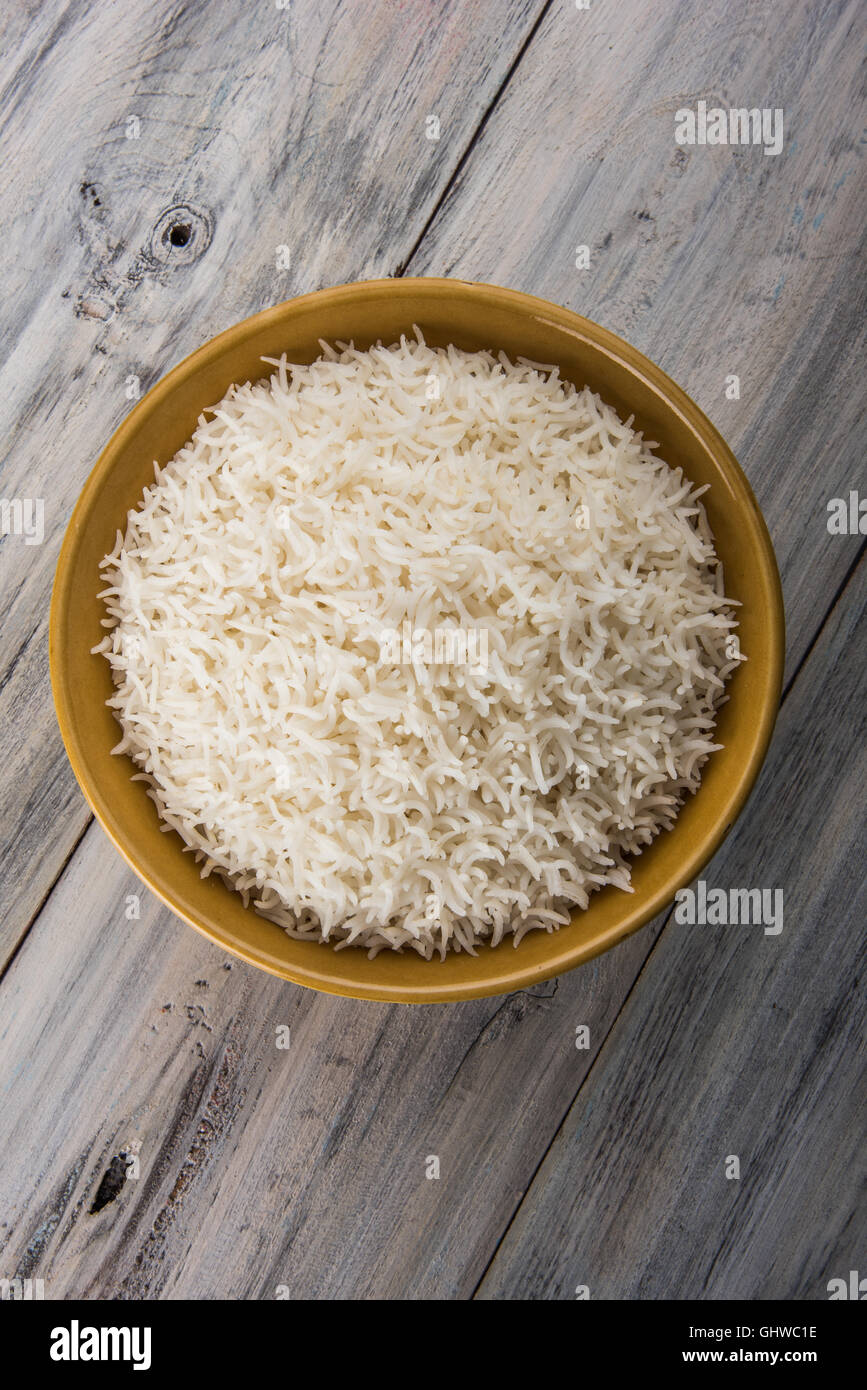 basmati rice in a brass bowl, cooked basmati rice, cooked plain rice