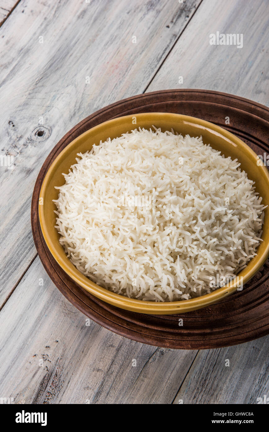 basmati rice in a brass bowl, cooked basmati rice, cooked plain rice