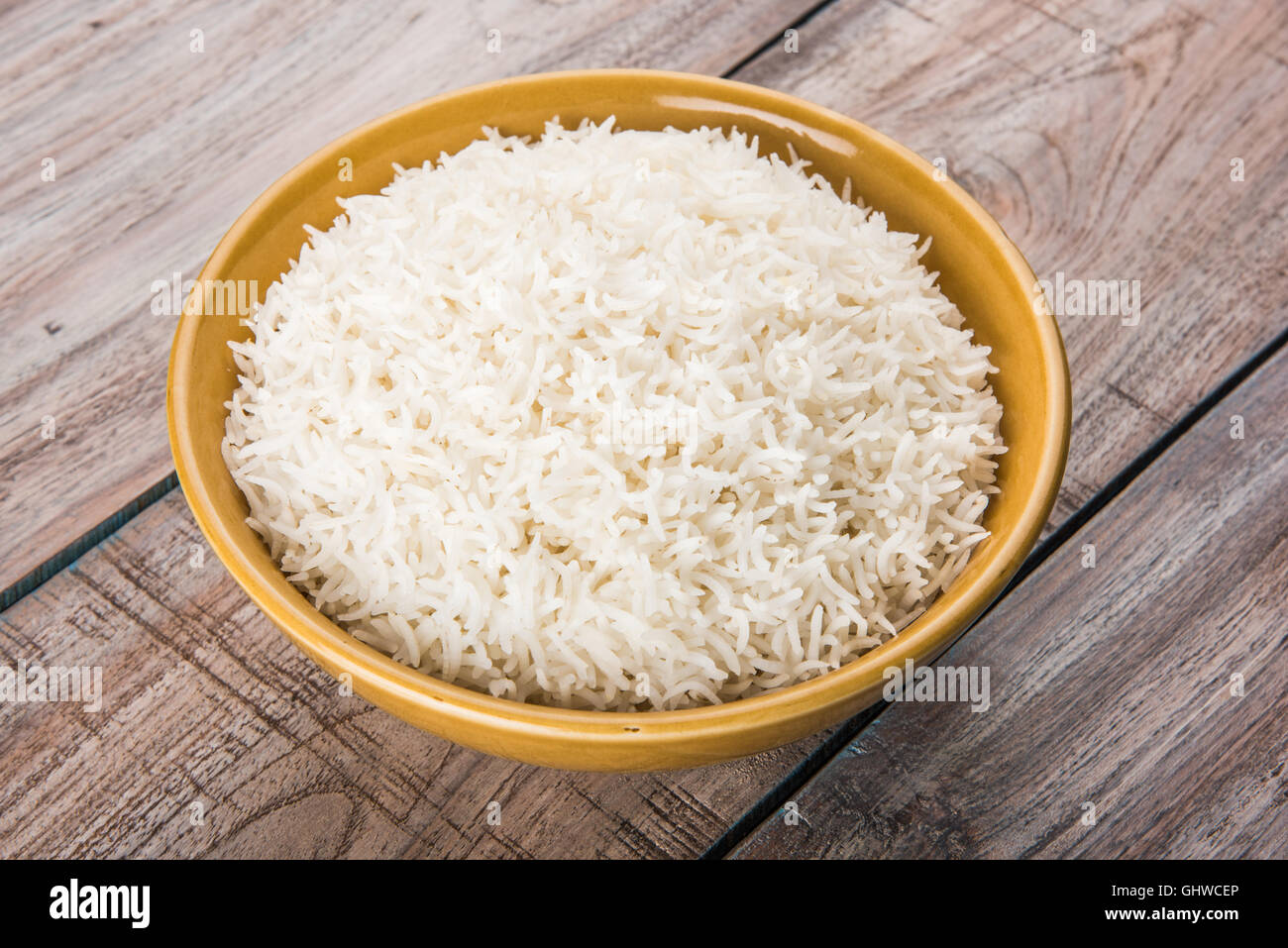 basmati rice in a brass bowl, cooked basmati rice, cooked plain rice