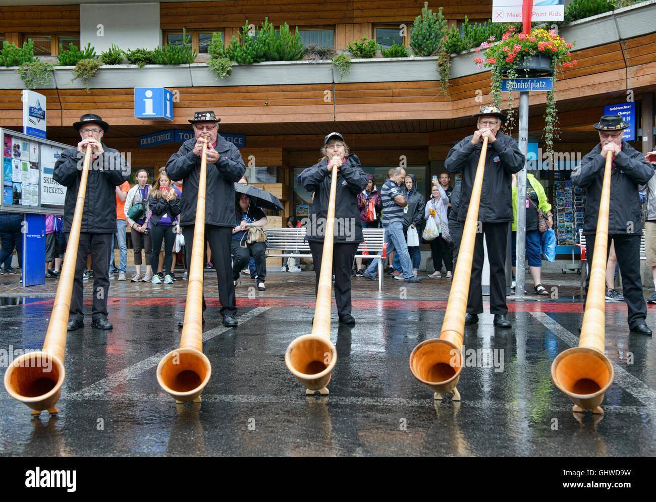 Musicians playing the traditional alp horn (alpenhorn) in Zermatt, Switzerland Stock Photo