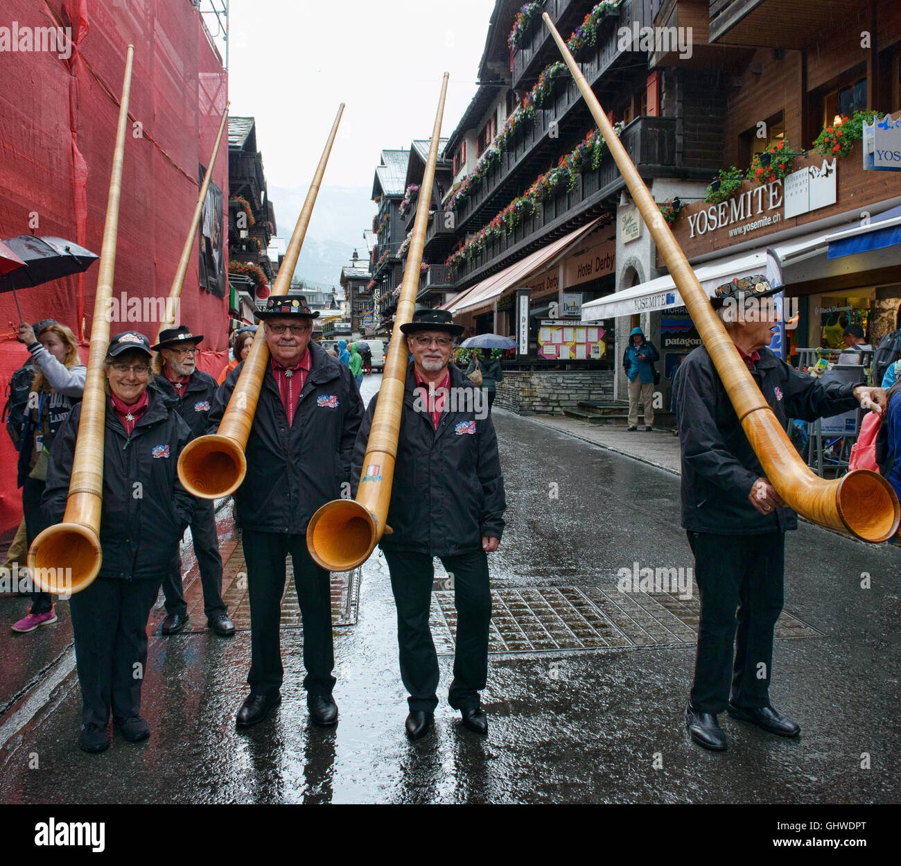 Musicians playing the traditional alp horn (alpenhorn) in Zermatt, Switzerland Stock Photo