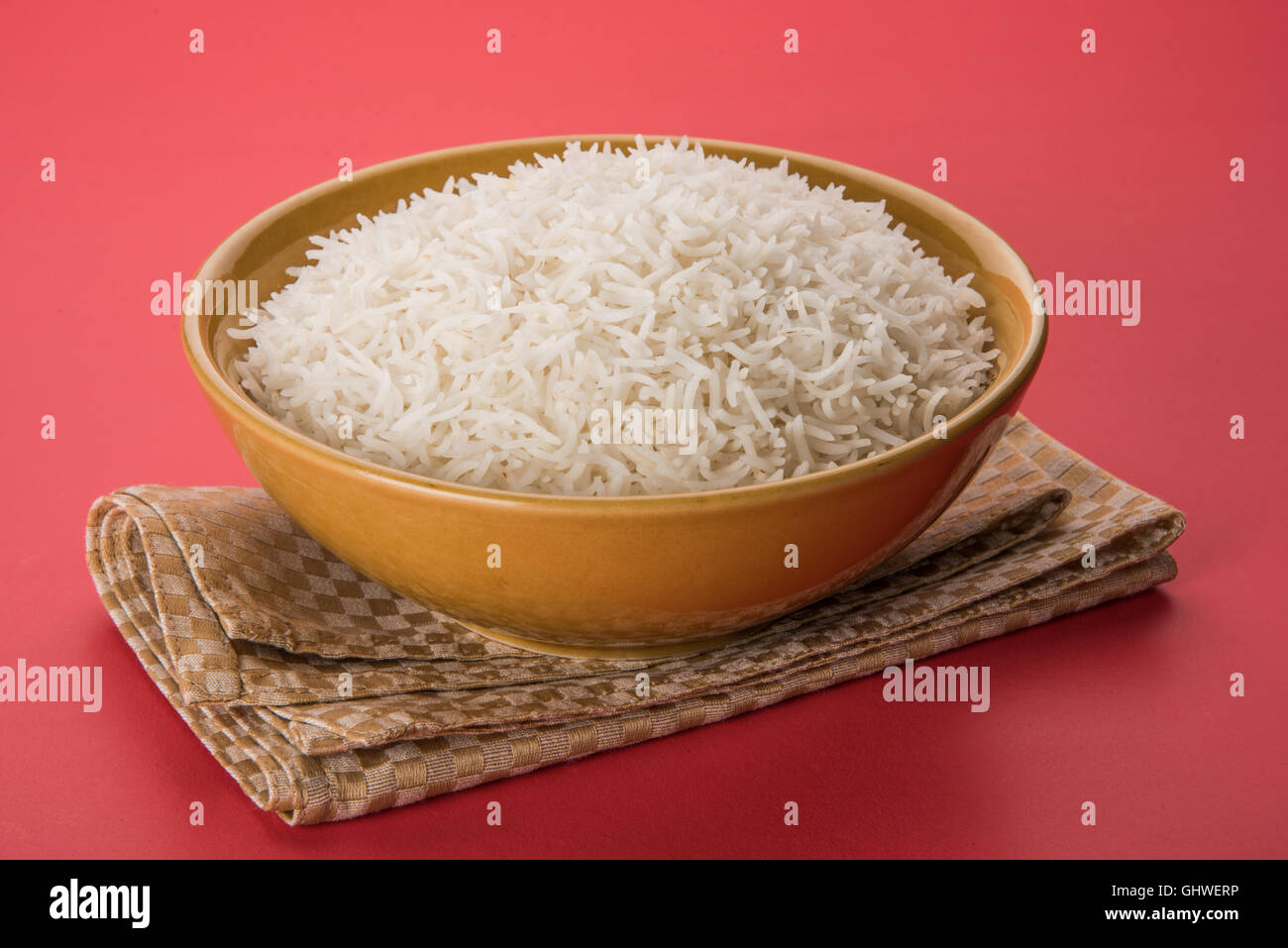 basmati rice in a brass bowl, cooked basmati rice, cooked plain rice