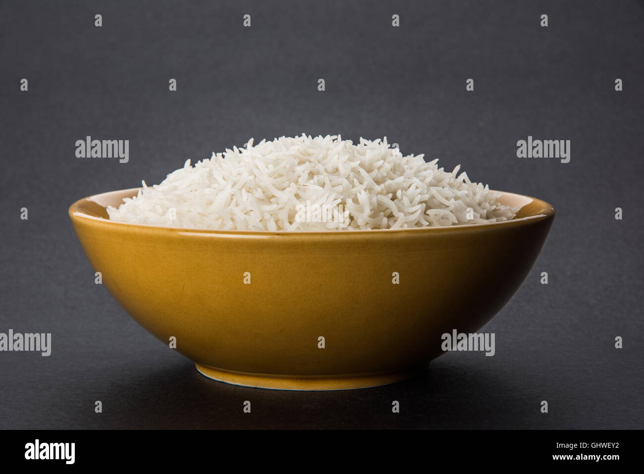 basmati rice in a brass bowl, cooked basmati rice, cooked plain rice