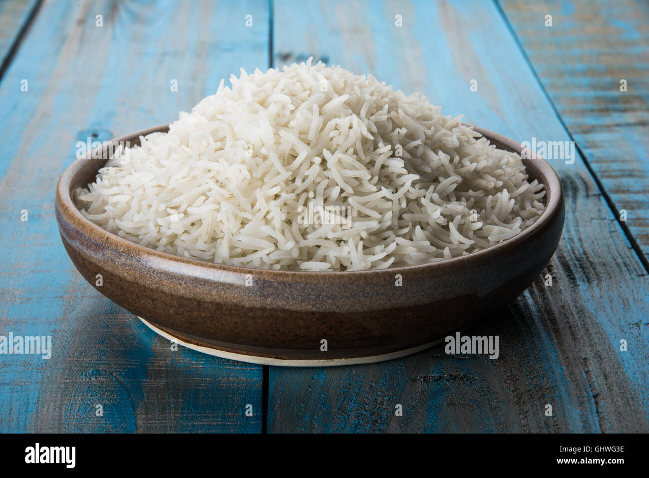 basmati rice in a brass bowl, cooked basmati rice, cooked plain rice