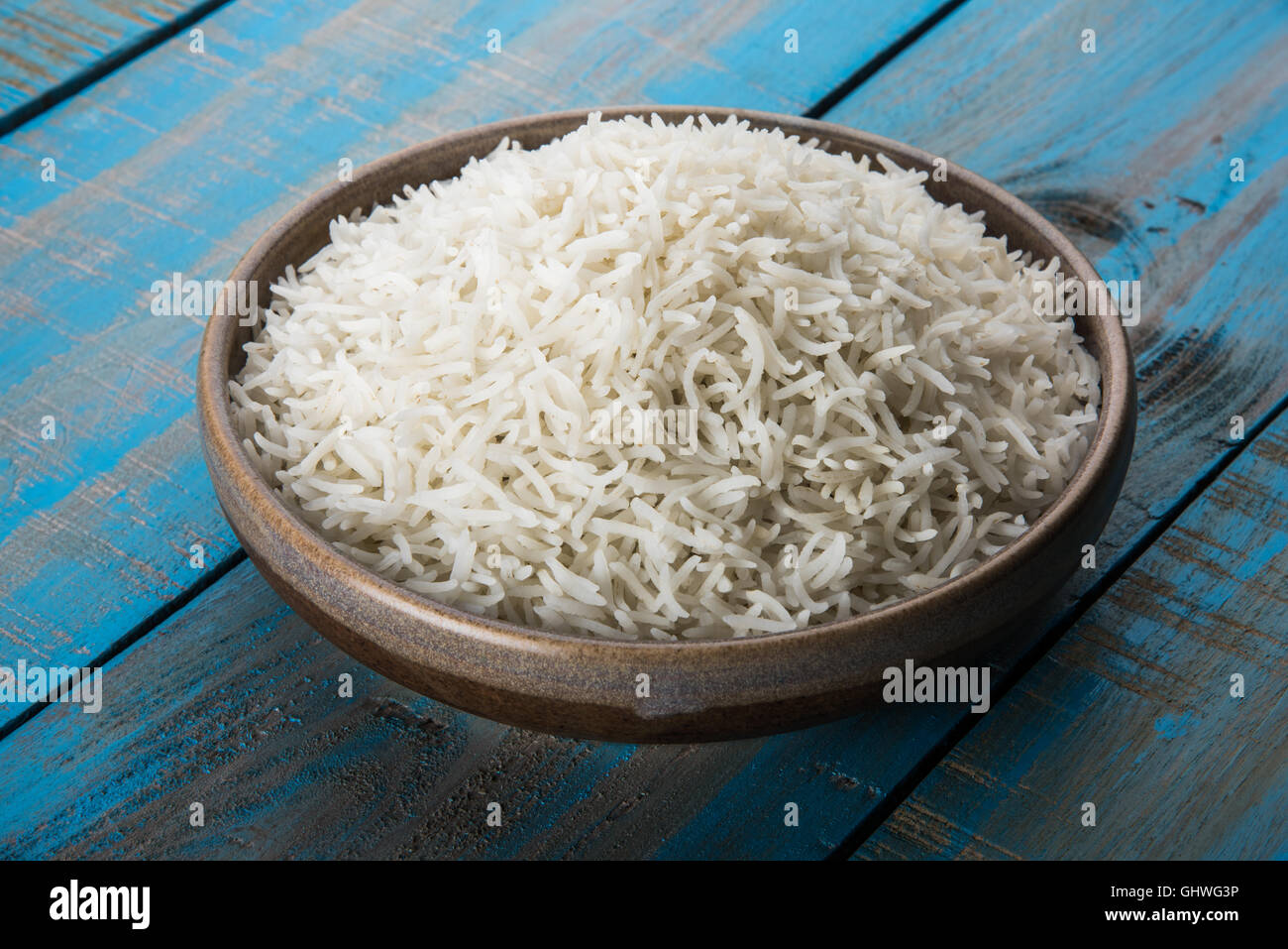 basmati rice in a brass bowl, cooked basmati rice, cooked plain rice