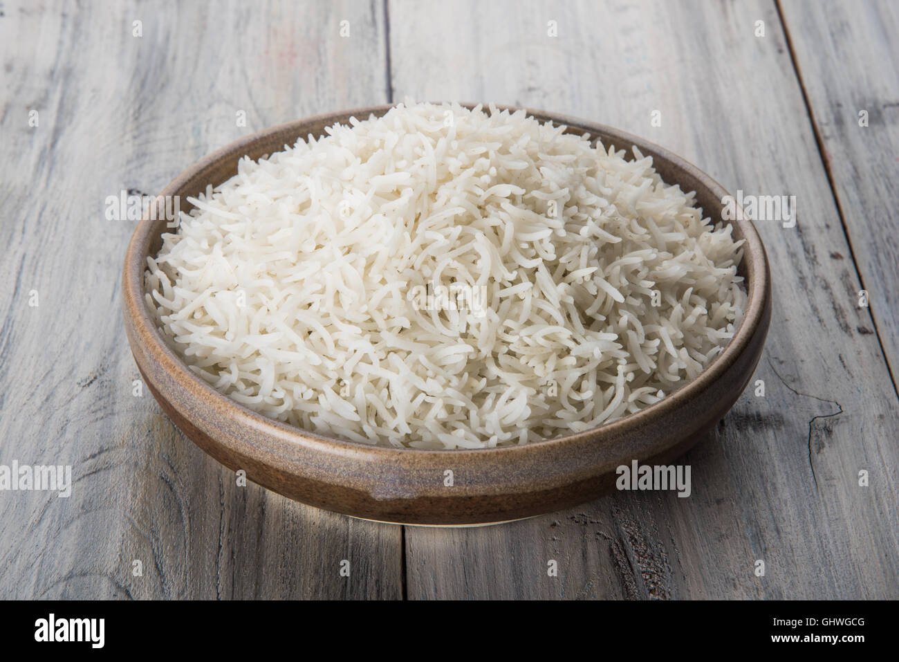 basmati rice in a brass bowl, cooked basmati rice, cooked plain rice