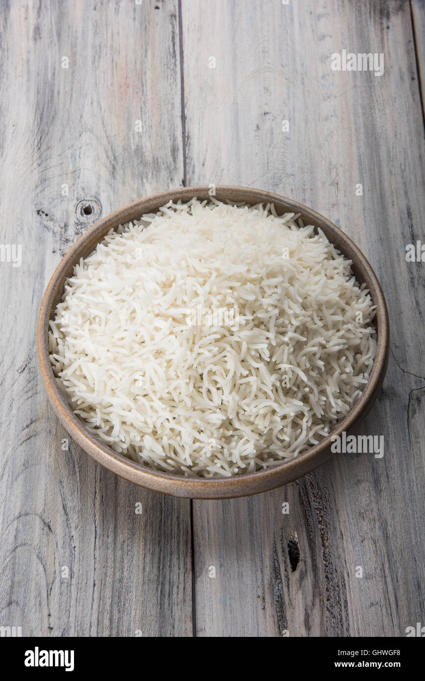 basmati rice in a brass bowl, cooked basmati rice, cooked plain rice
