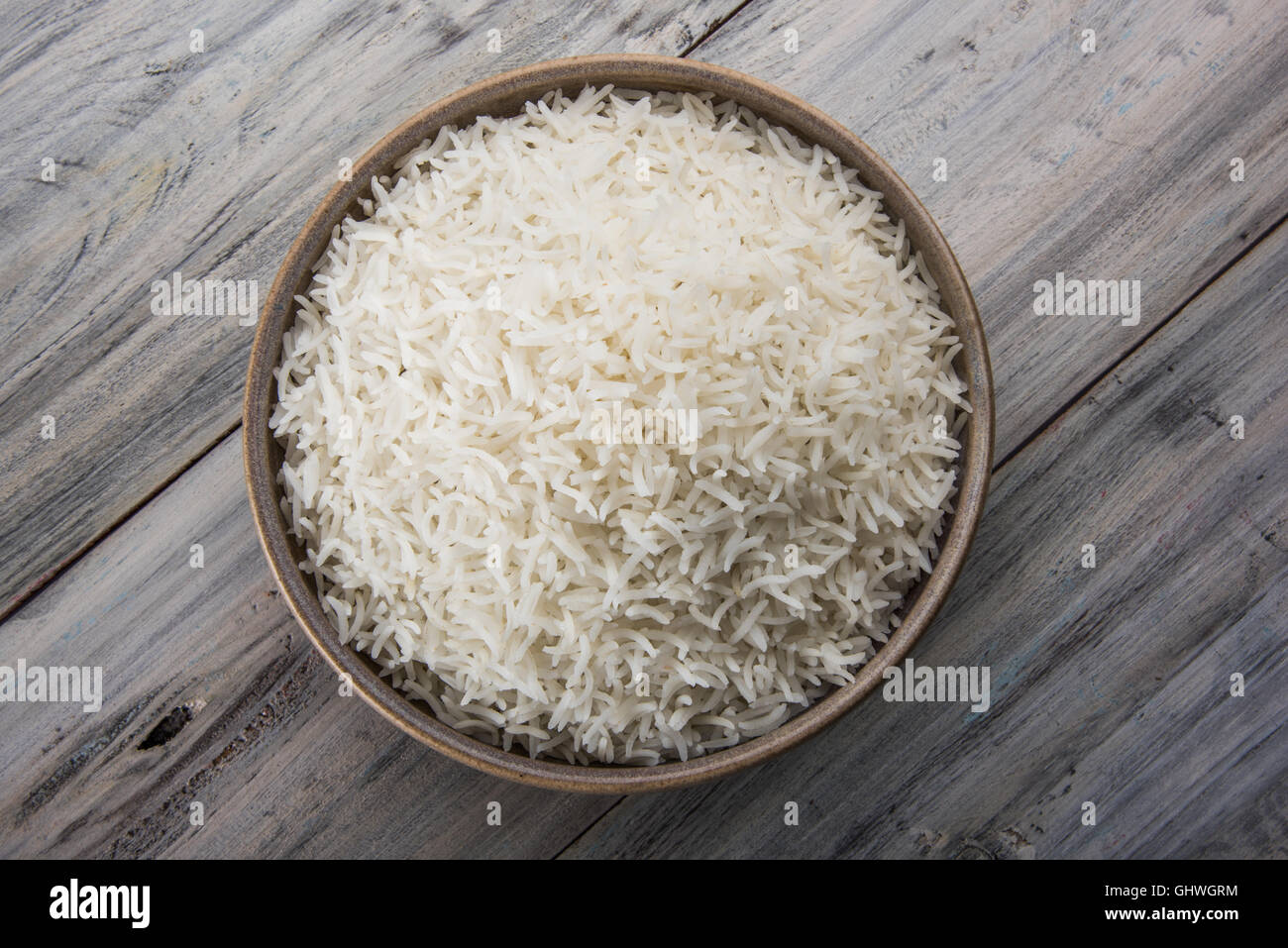 basmati rice in a brass bowl, cooked basmati rice, cooked plain rice