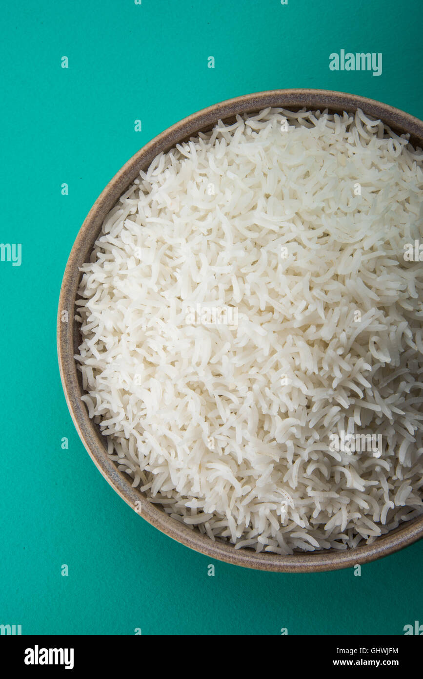 basmati rice in a brass bowl, cooked basmati rice, cooked plain rice