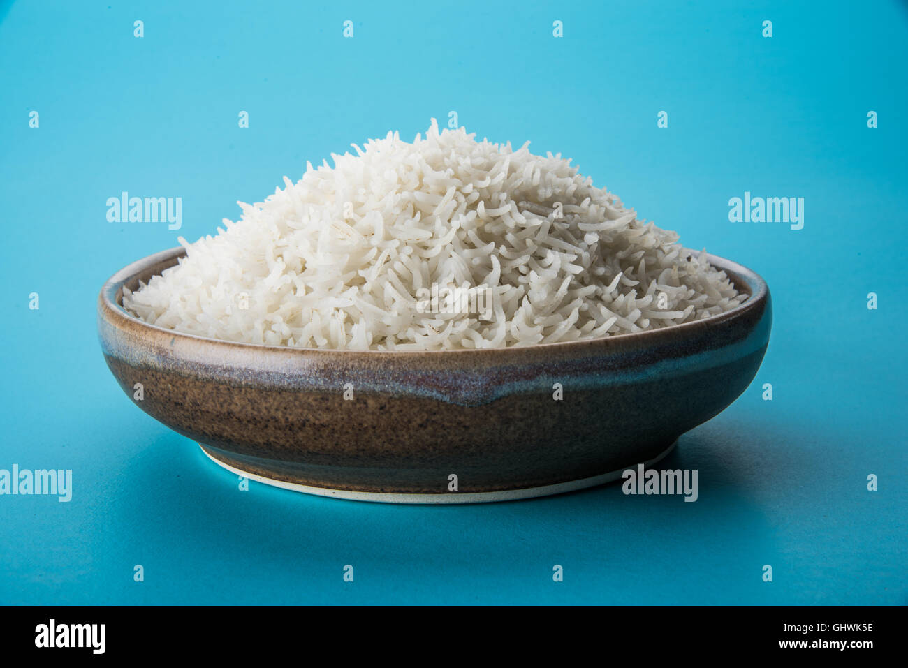 basmati rice in a brass bowl, cooked basmati rice, cooked plain rice