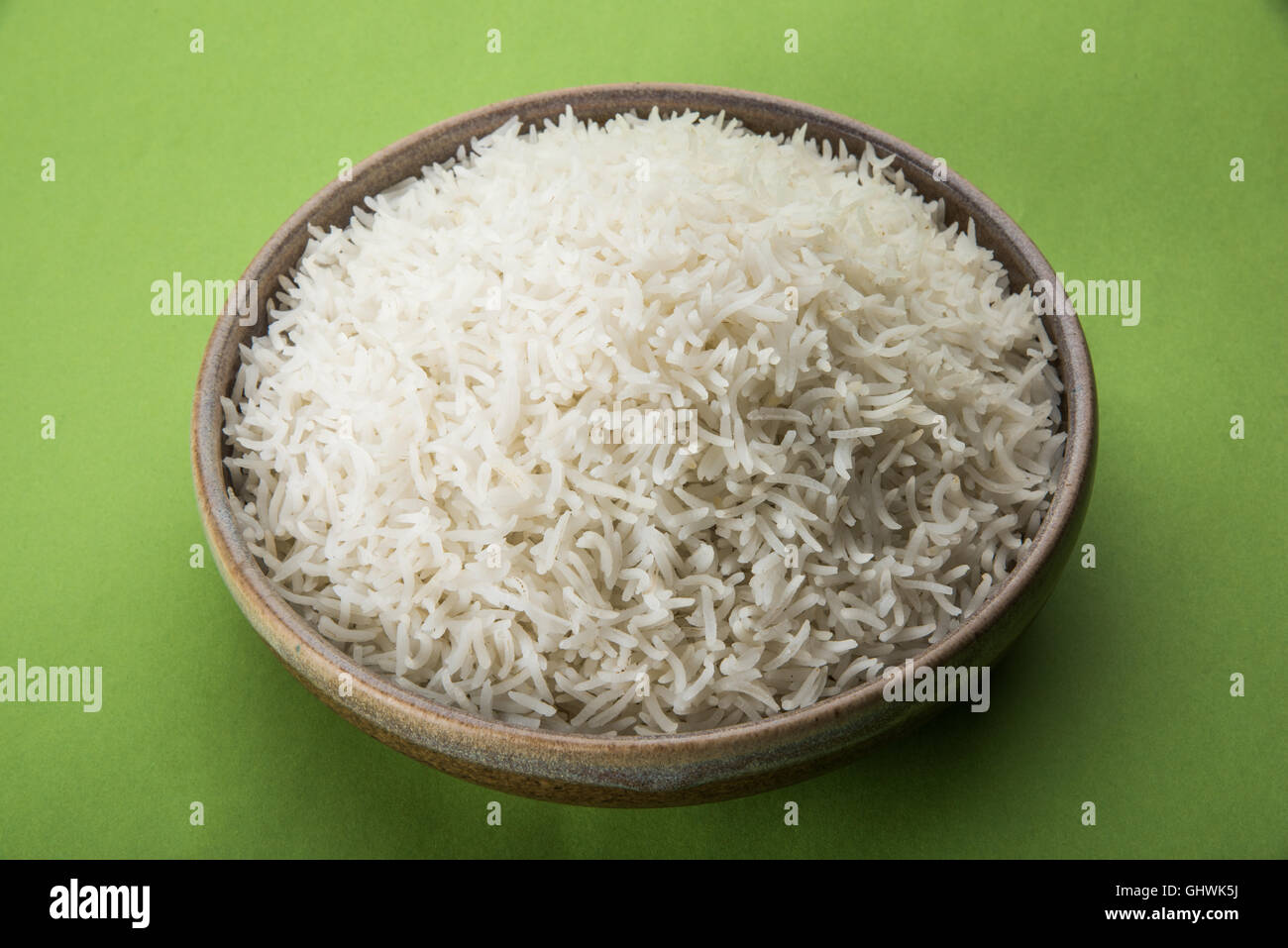 basmati rice in a brass bowl, cooked basmati rice, cooked plain rice
