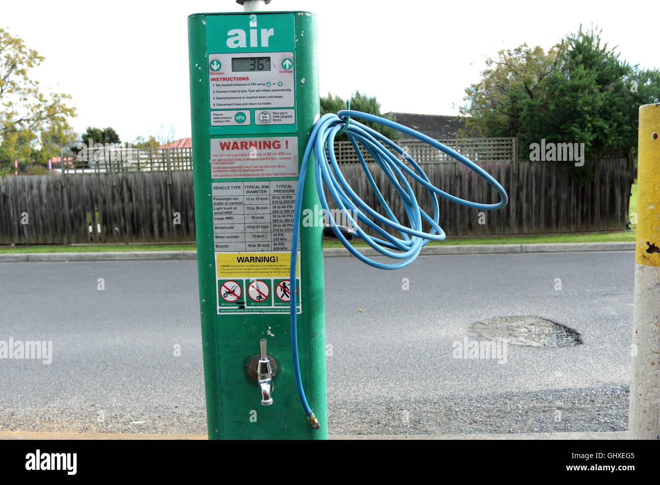 Air Pressure pump hose at BP Petrol Station in Melbourne Victoria Australia Stock Photo