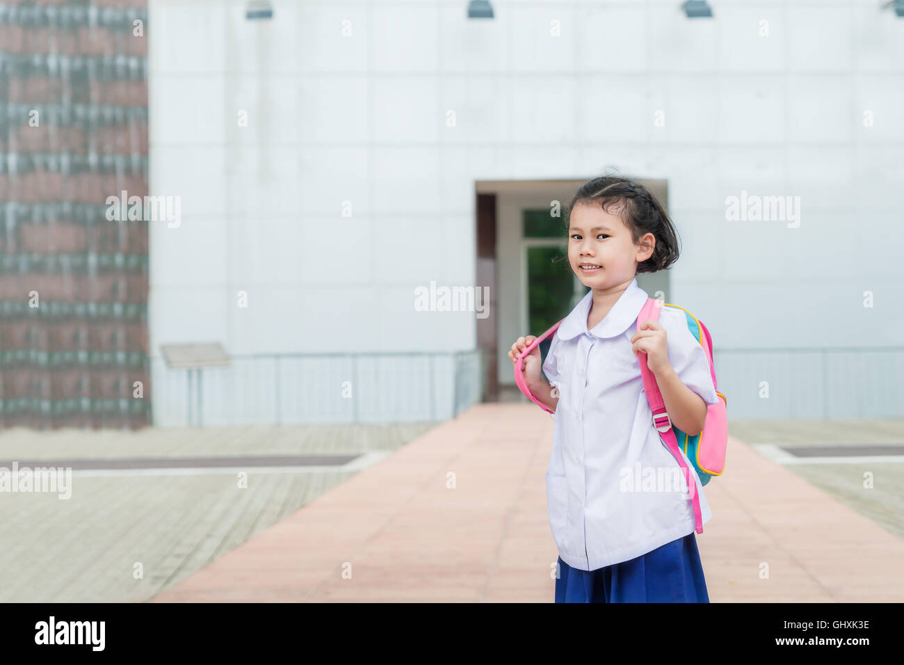 Asian girl kid student in uniform going to school. Student back to school concept. Stock Photo