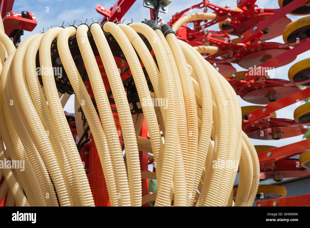 plastic hose to the agricultural machine Stock Photo