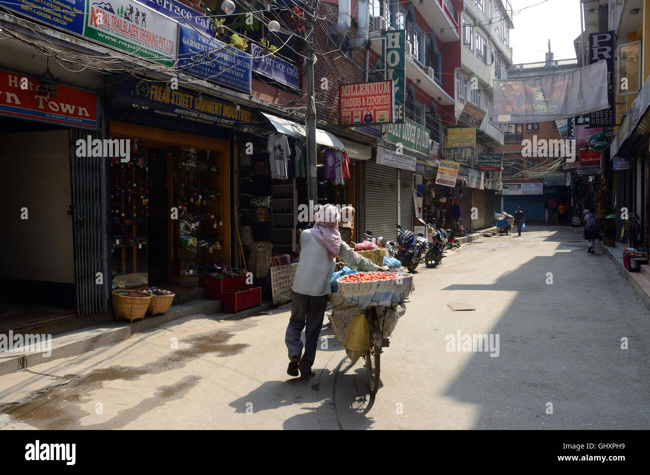 THAMEL,KATHMANDU,NEPAL - APRIL 30: Unidentified local people walking along famous Freak street (Jhochhen Tole) on April 30, 2013 Stock Photo