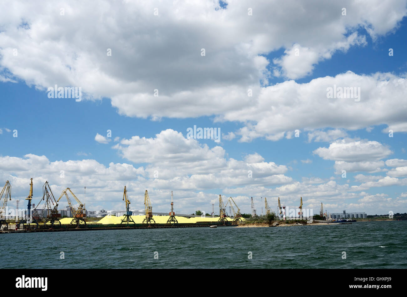 Cargo port with cranes and sulphur firestone near Odessa,Black sea coast,Ukraine Stock Photo